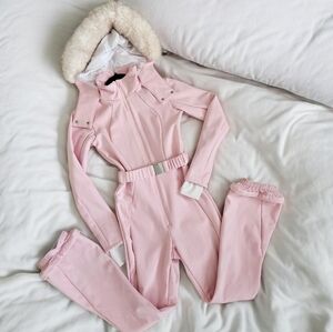 4505 Ski belted ski suit with slim kick leg and faux fur hood in Pink
